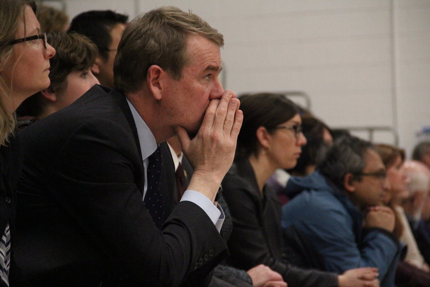 U.S. Sen. Michael Bennet, a Democrat of Colorado, sits after speaking at a May 8 vigil at Highlands Ranch High School for STEM School shooting victims and survivors.